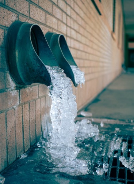 water flowing out of drain pipe